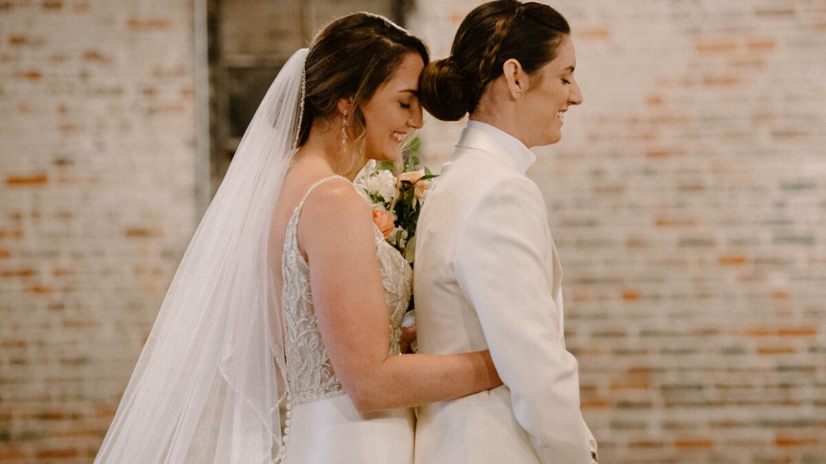 These lesbian brides had a classic and elegant summer wedding with NOLA traditions