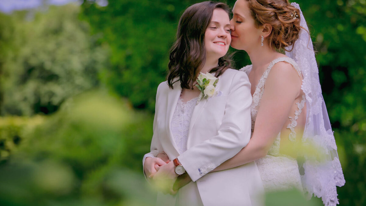 These queer brides celebrated their summer wedding with a new combined last name and a reading from a landmark marriage equality case