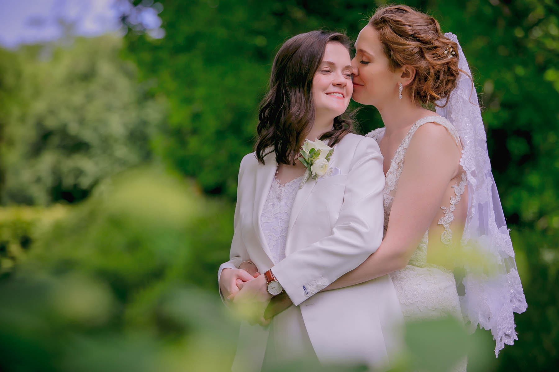 These queer brides celebrated their summer wedding with a new combined last name and a reading from a landmark marriage equality case image