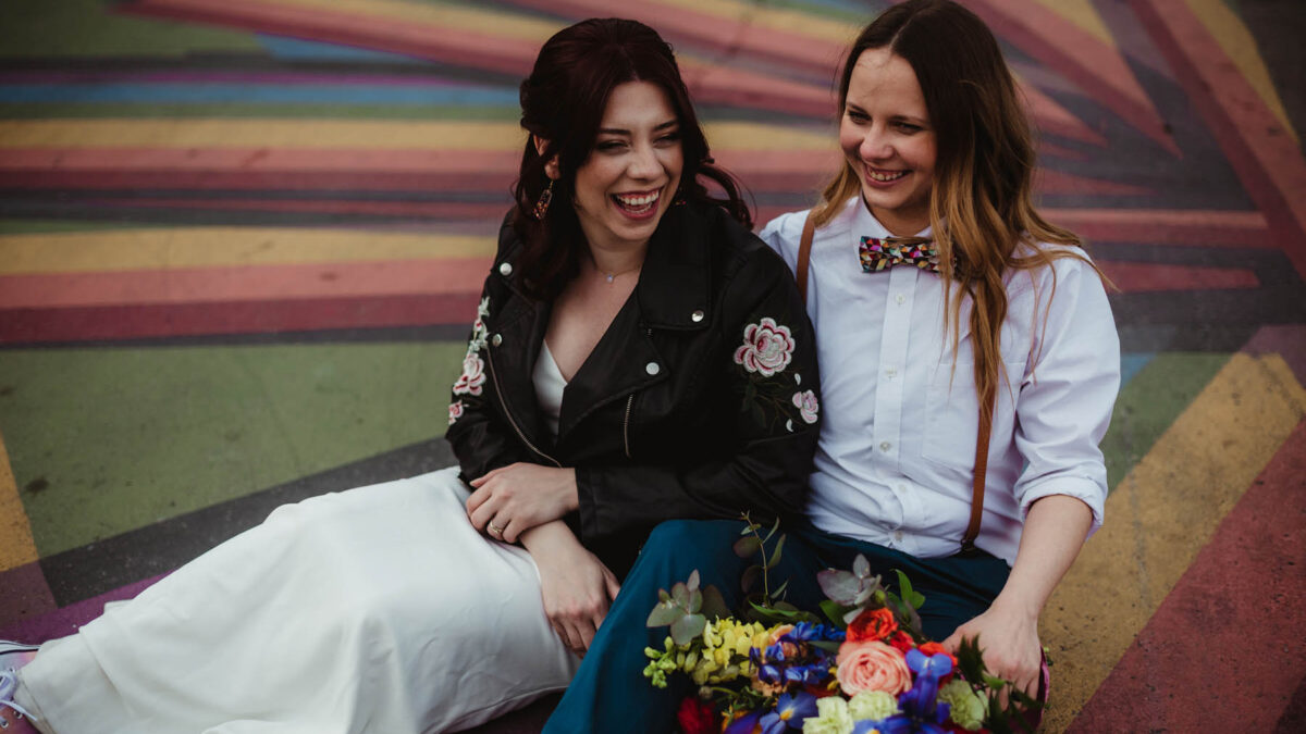 Celebrating LGBTQ+ love with a colorful Pride elopement photo shoot featuring rainbows, glitter and custom cocktails
