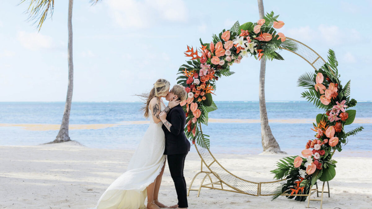 These lesbian brides met on Tinder and married in a destination elopement at a beach club in Punta Cana, Dominican Republic