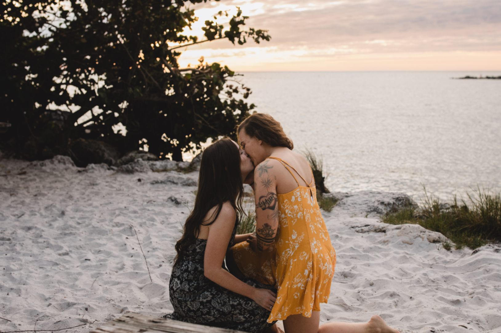 two women share a kiss after getting engaged