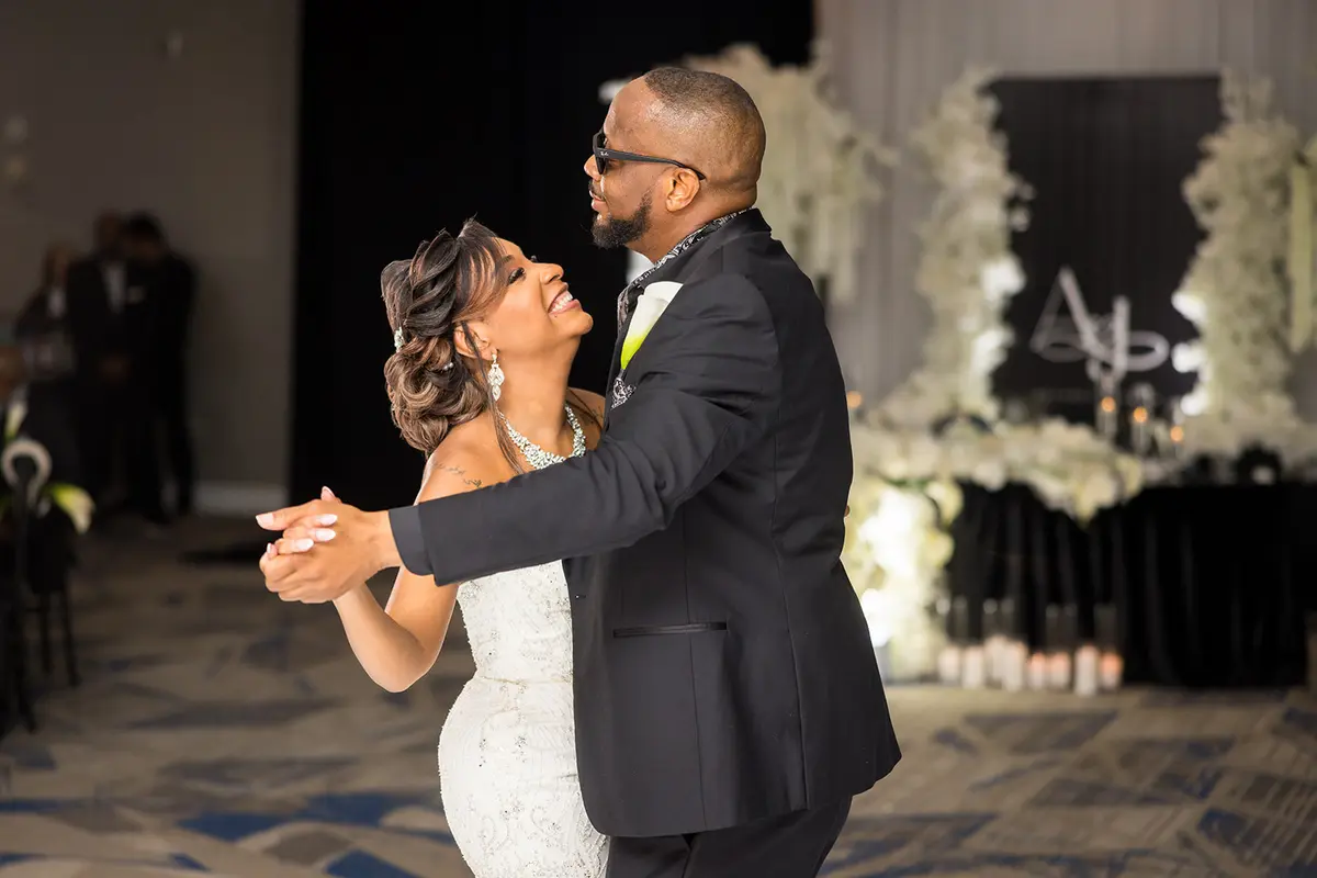 Black bride Daniella dancing with brother at Atlanta LGBTQ wedding reception