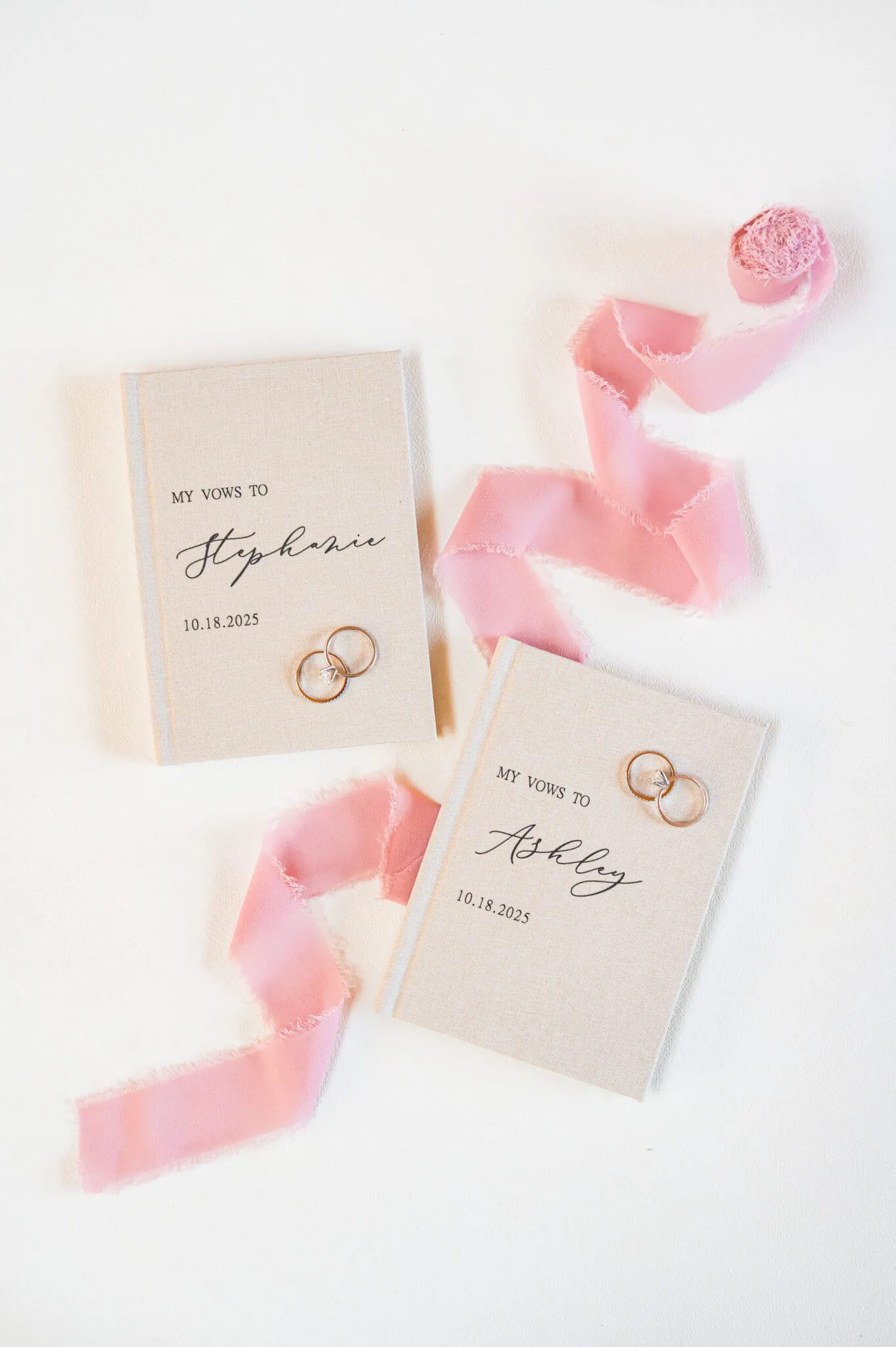 Lesbian wedding vow book with pink ribbon