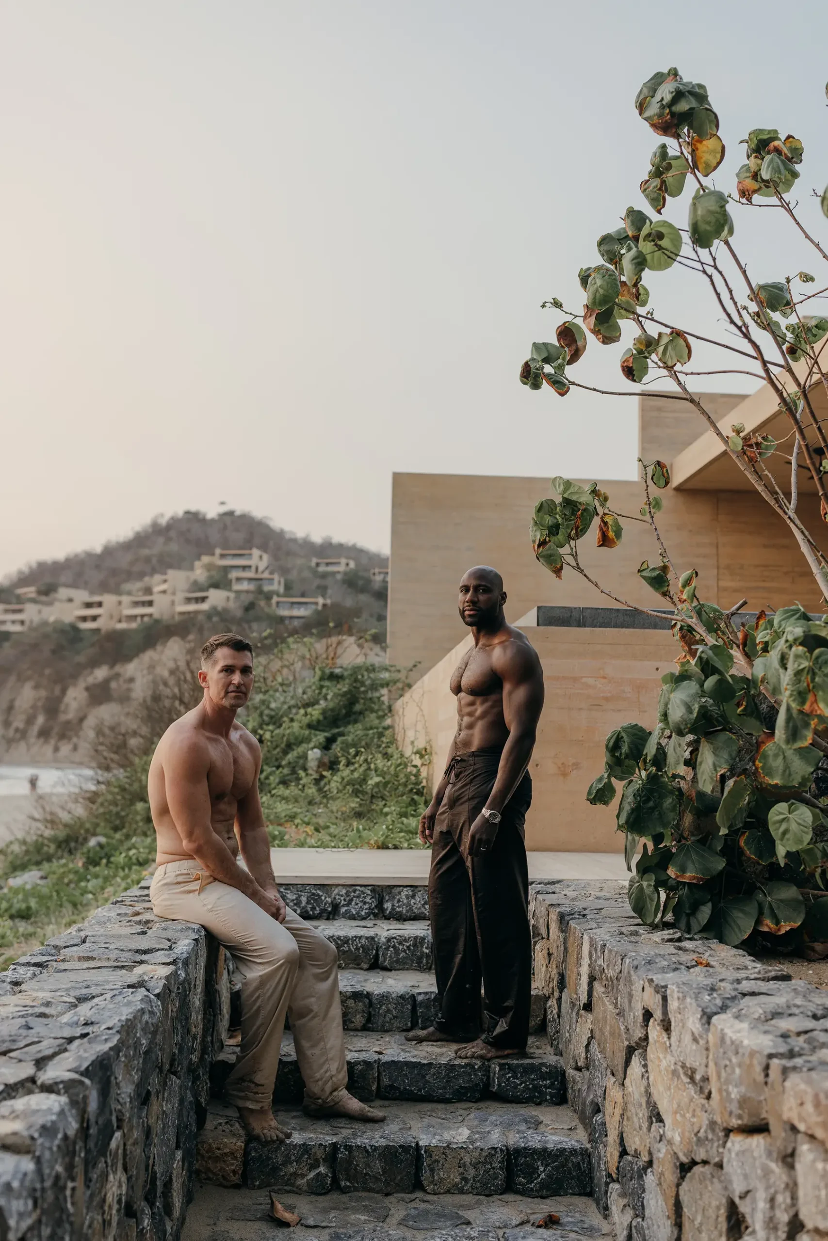 Khasan Brailsford and Jason Silverman in casual clothing for relaxed portraits at Four Seasons Tamarindo during wedding weekend