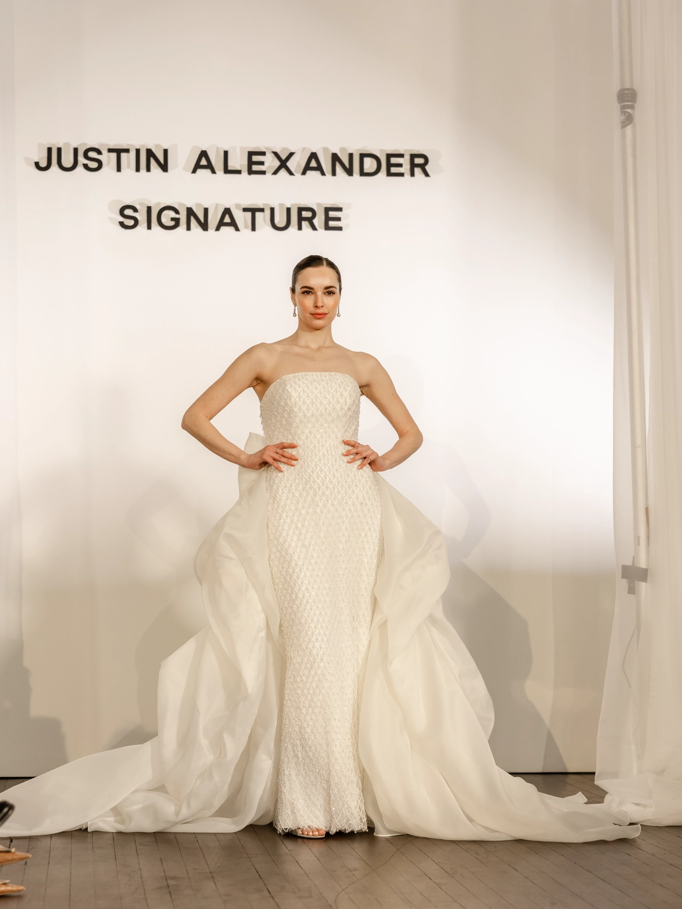 beaded bodice with voluminous train Justin Alexander wedding gown