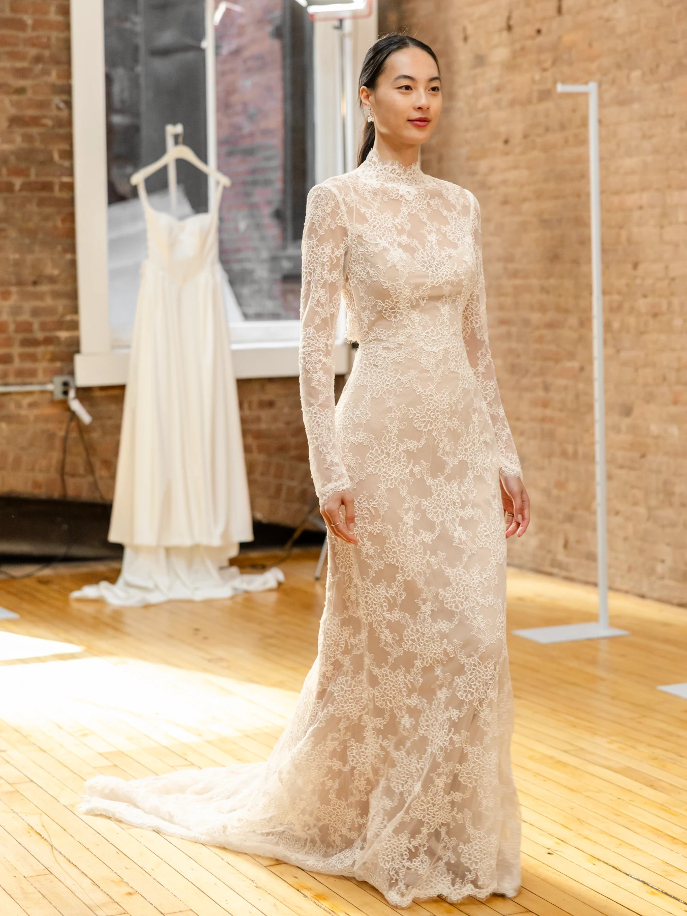 long-sleeve wedding gown dress with high neck and lace pattern