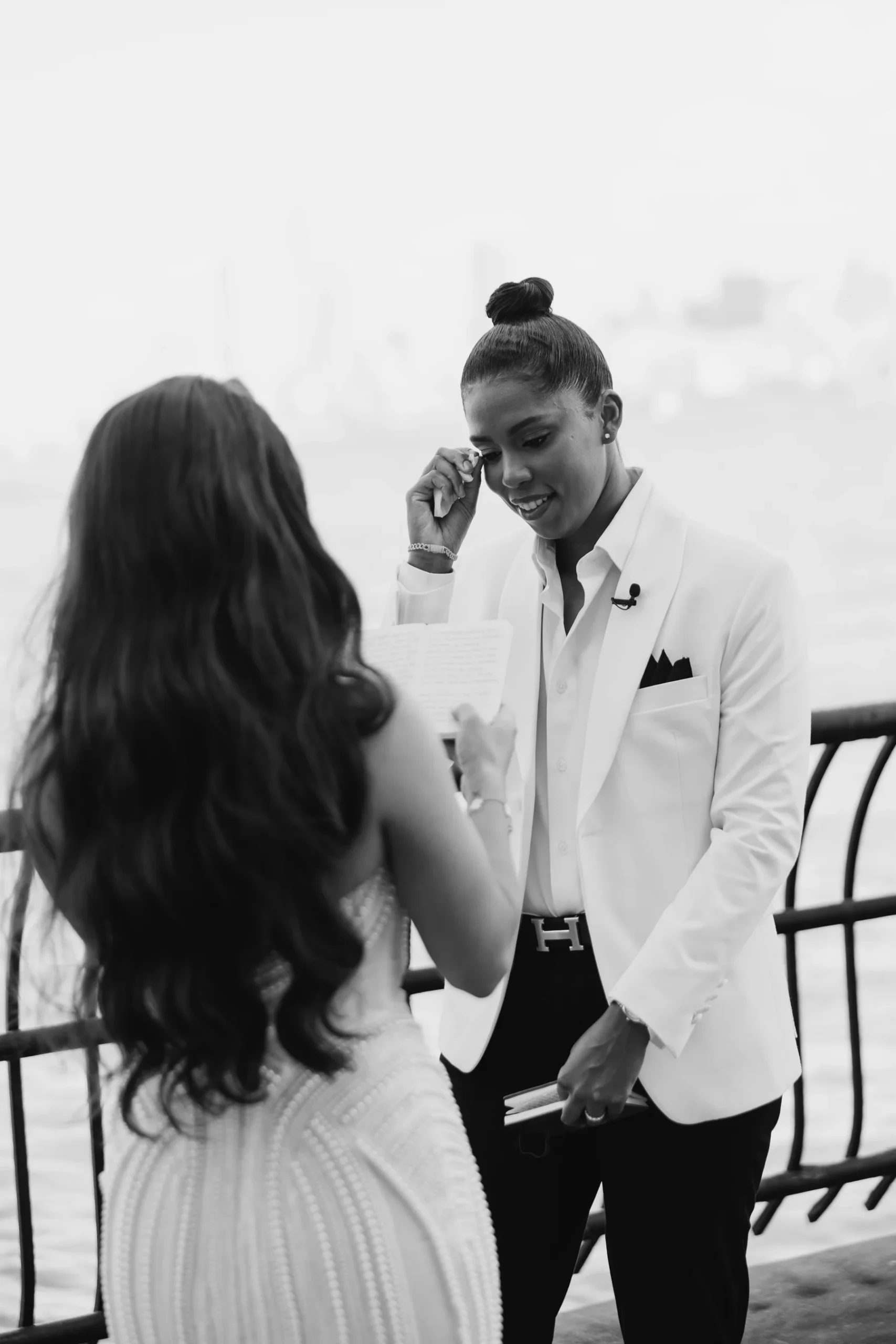 Michelle wipes away tears as Katherine reads wedding vows at Hudson House in Jersey City, NJ.