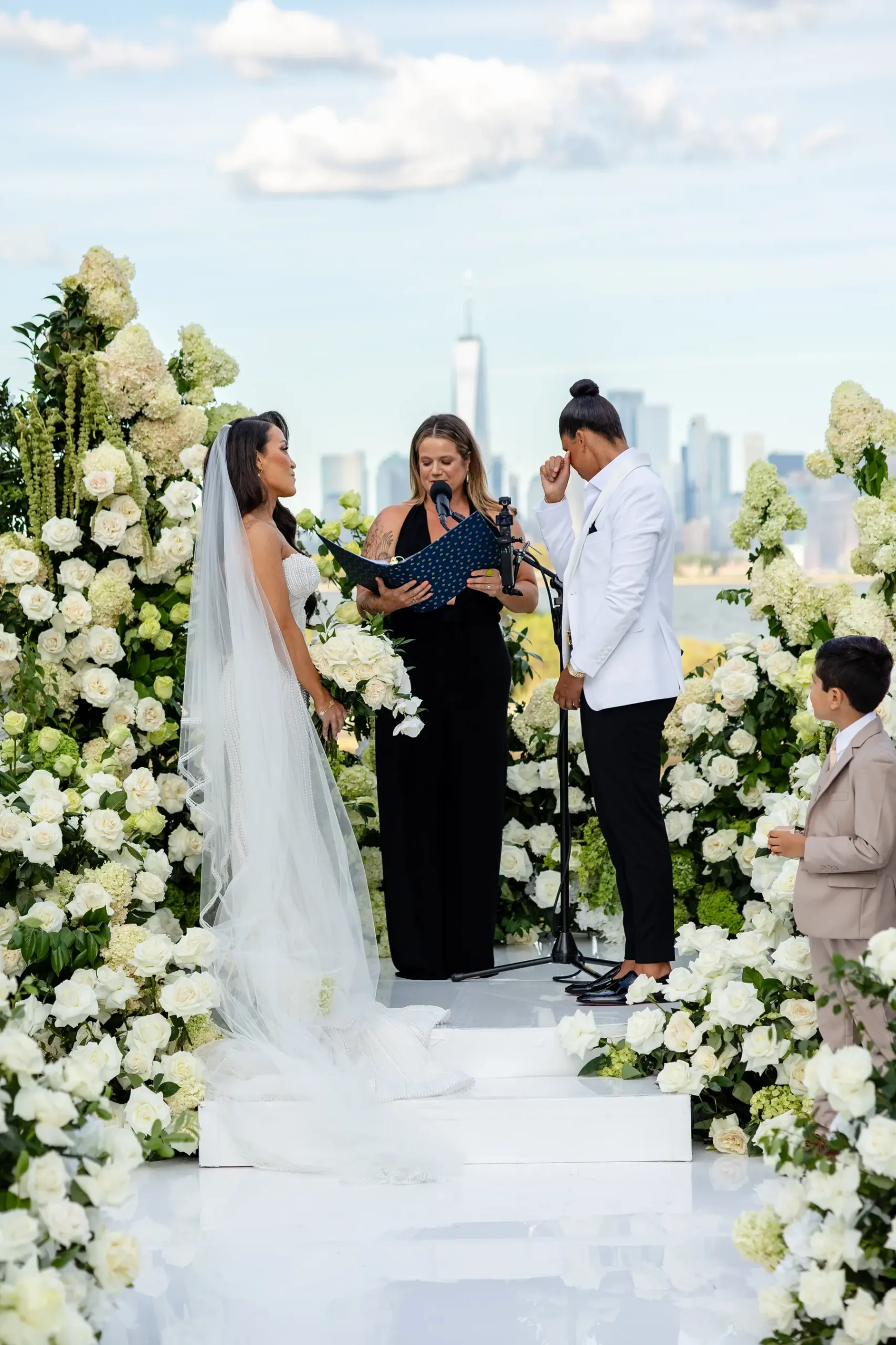 Katherine and Michelle exchange vows at Hudson House in Jersey City with the New York City skyline behind them.