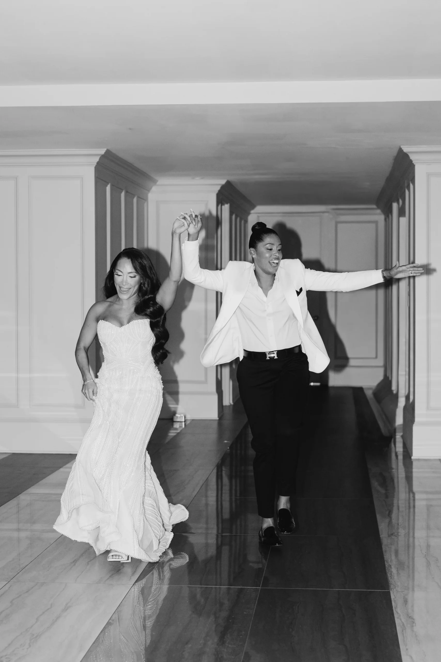 Katherine and Michelle make a joyful grand entrance holding hands at Hudson House in Jersey City, N.J.