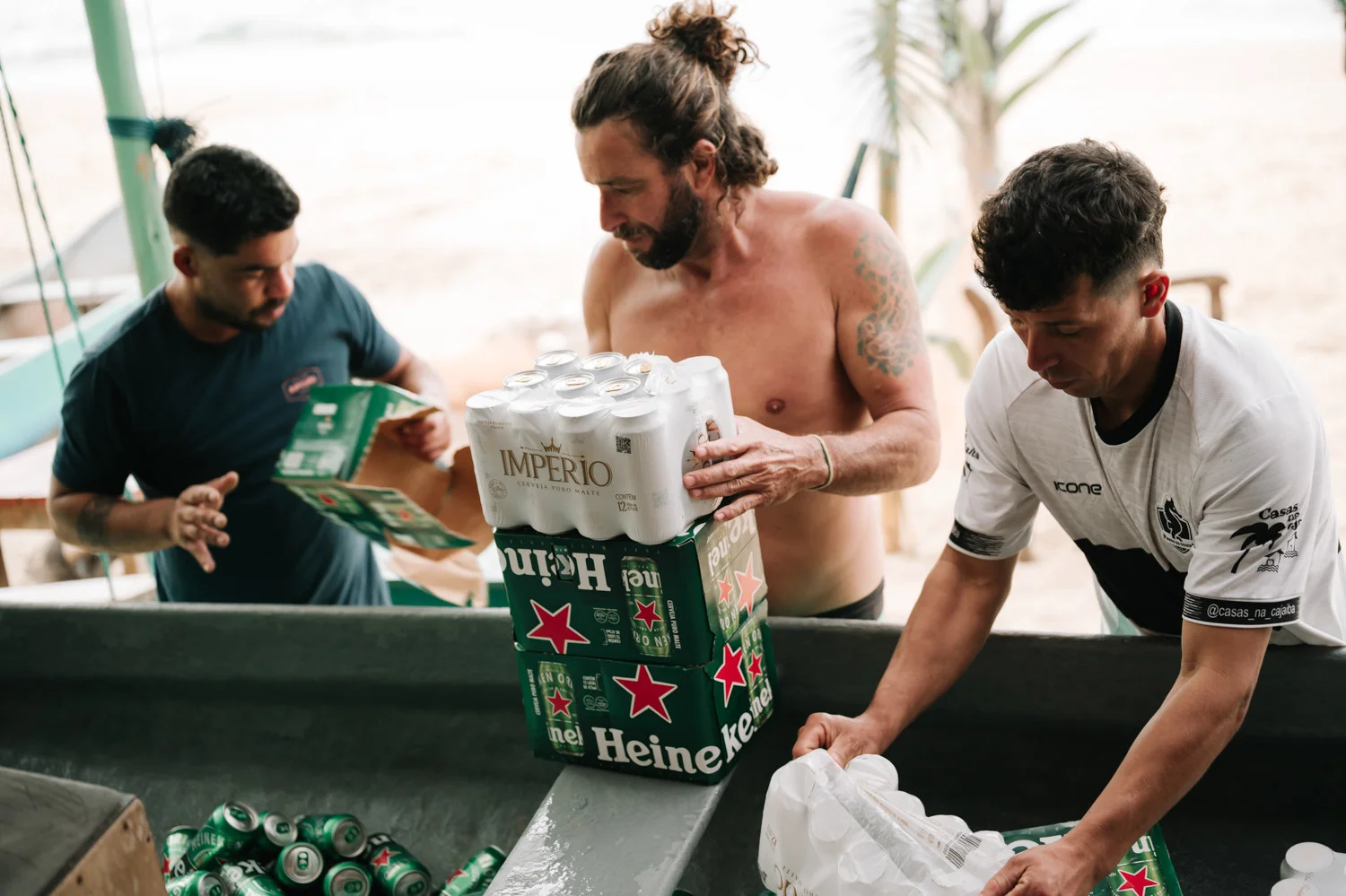 Guests unload cases of Heineken and Império beer at Pouso das Flores in Paraty, Brazil, for Rafaela and Nathalia's wedding.