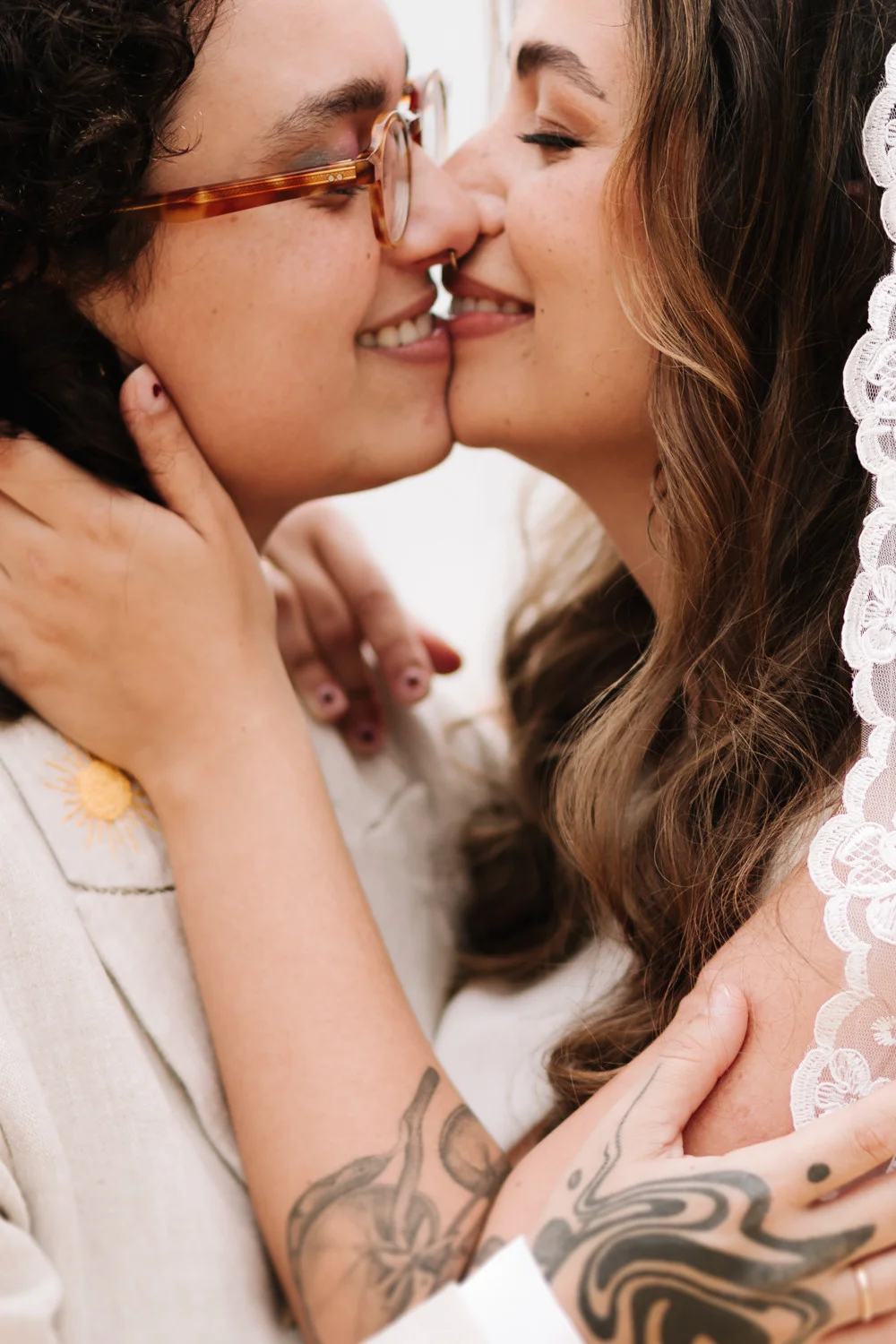 Rafaela and Nathalia share a joyful almost-kiss at Pouso das Flores in Paraty, Brazil.