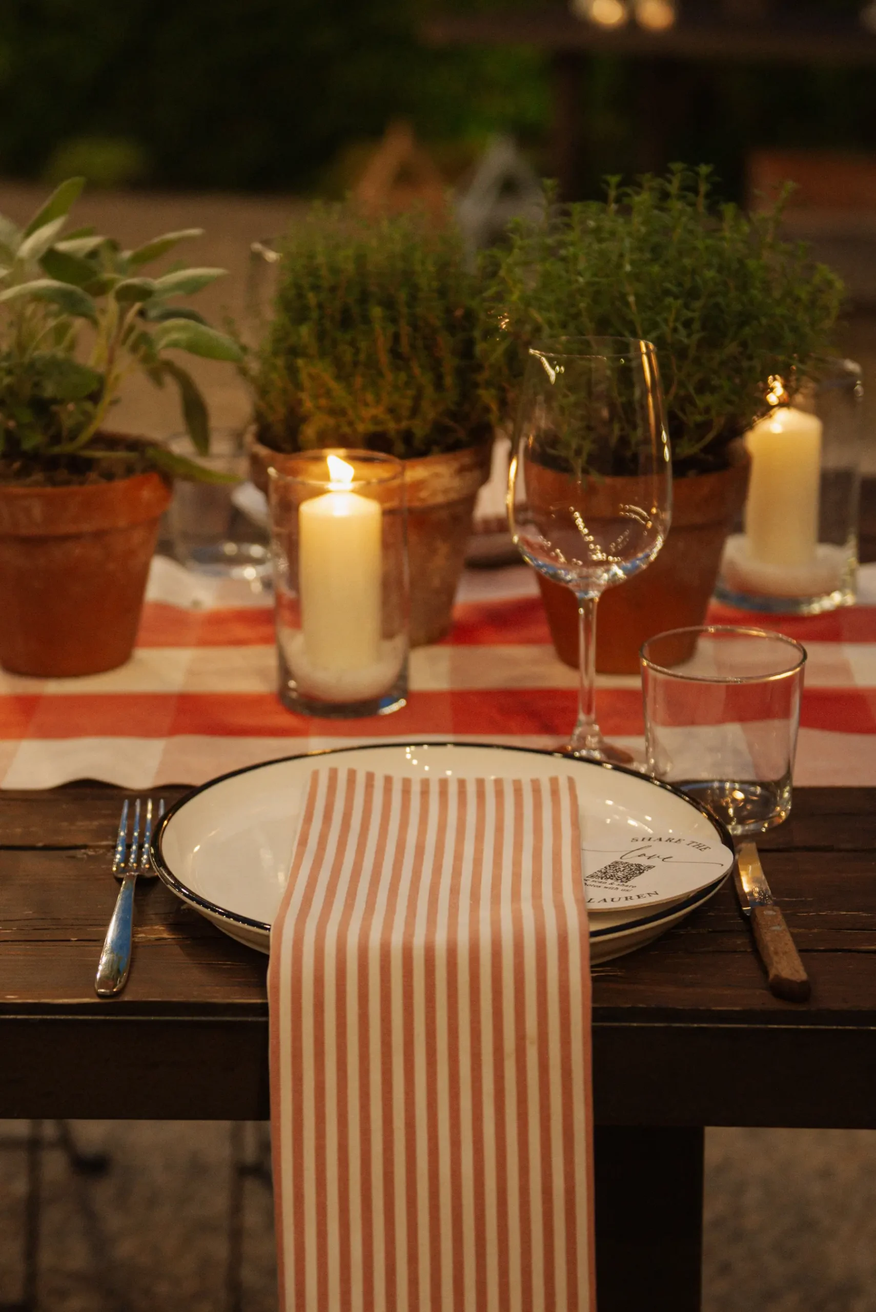 Candlelit outdoor tablescape at Casa Cornacchi in Tuscany for Lauren Thomas and Jasmine Shimerda's wedding.