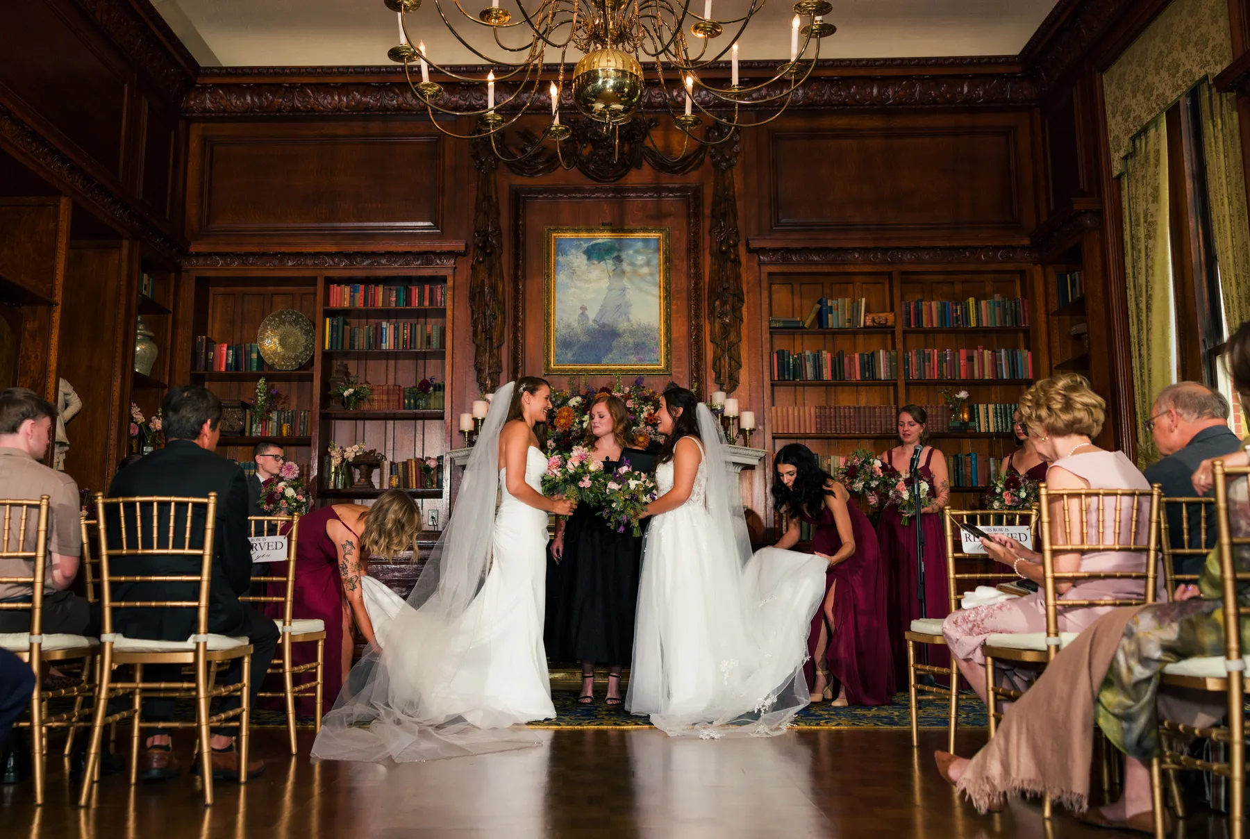 Brides Ashton Hattori and Stephanie Tillman exchange vows in the wood-paneled library at Hampshire House in Boston.