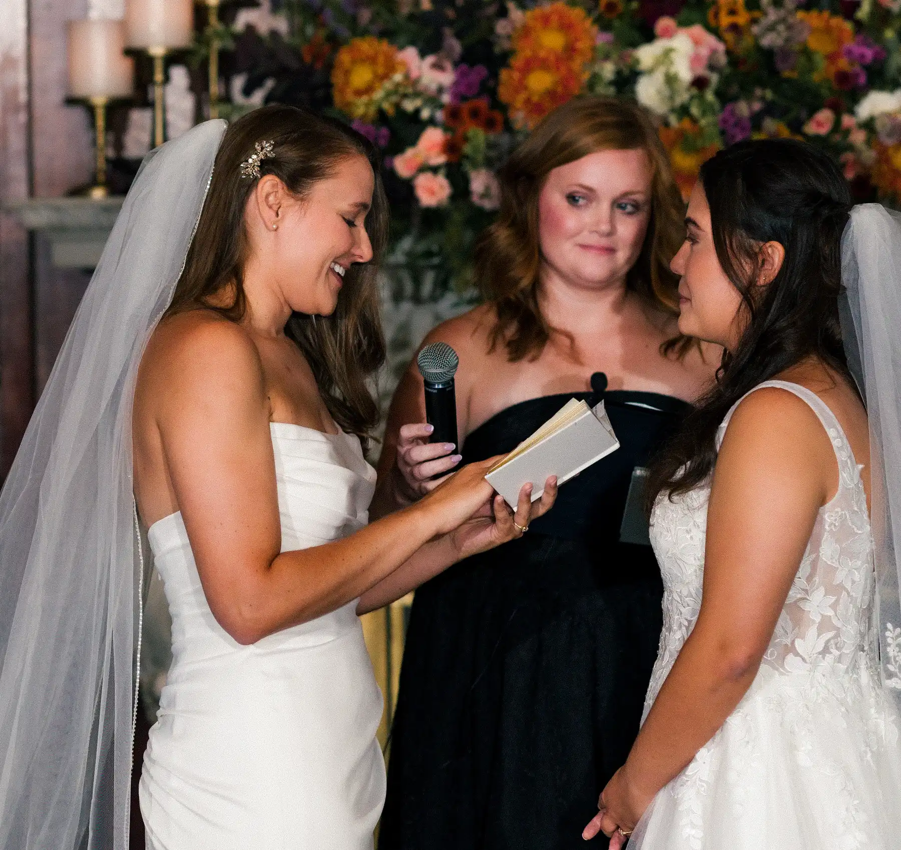 Ashton Hattori reads vows to Stephanie Tillman during their wedding ceremony at Hampshire House in Boston.