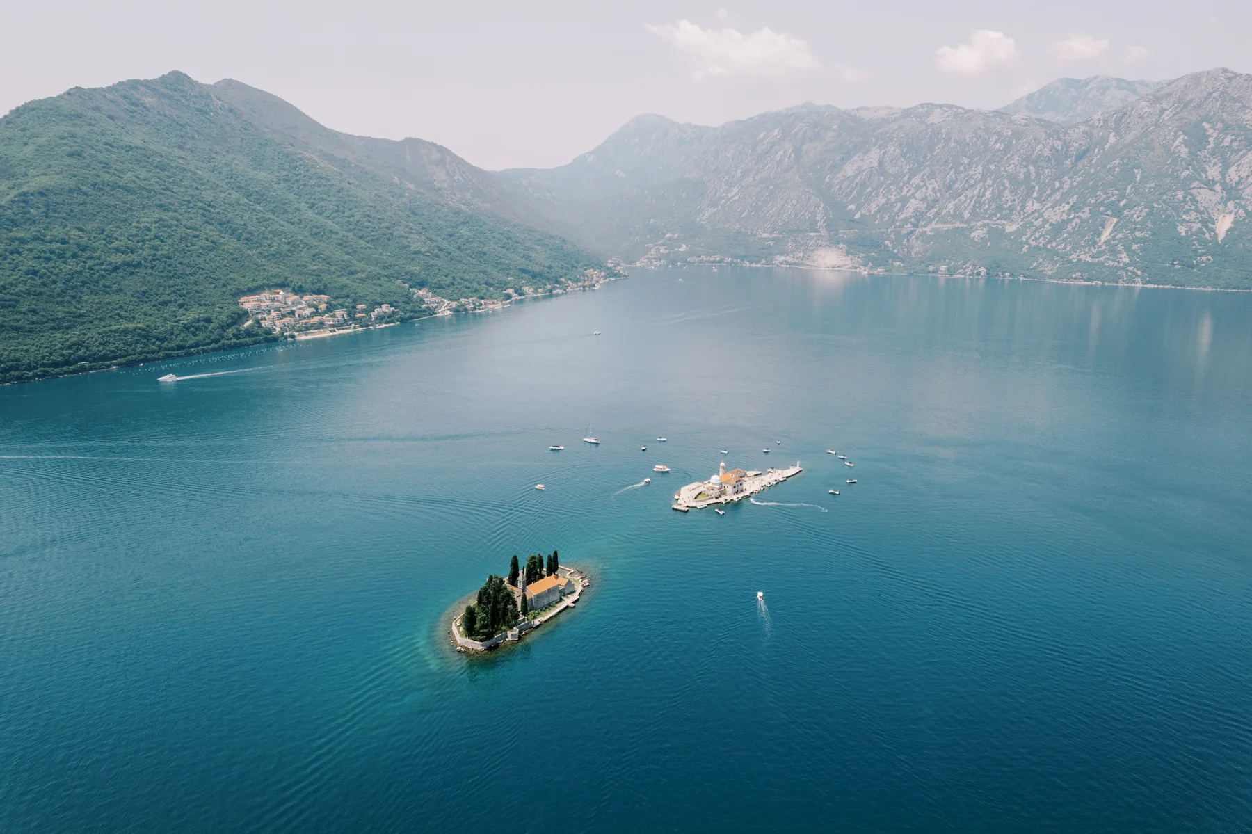 Aerial view of two small islands in the Bay of Kotor near Perast, Montenegro, site of Ryan and Jori's wedding.