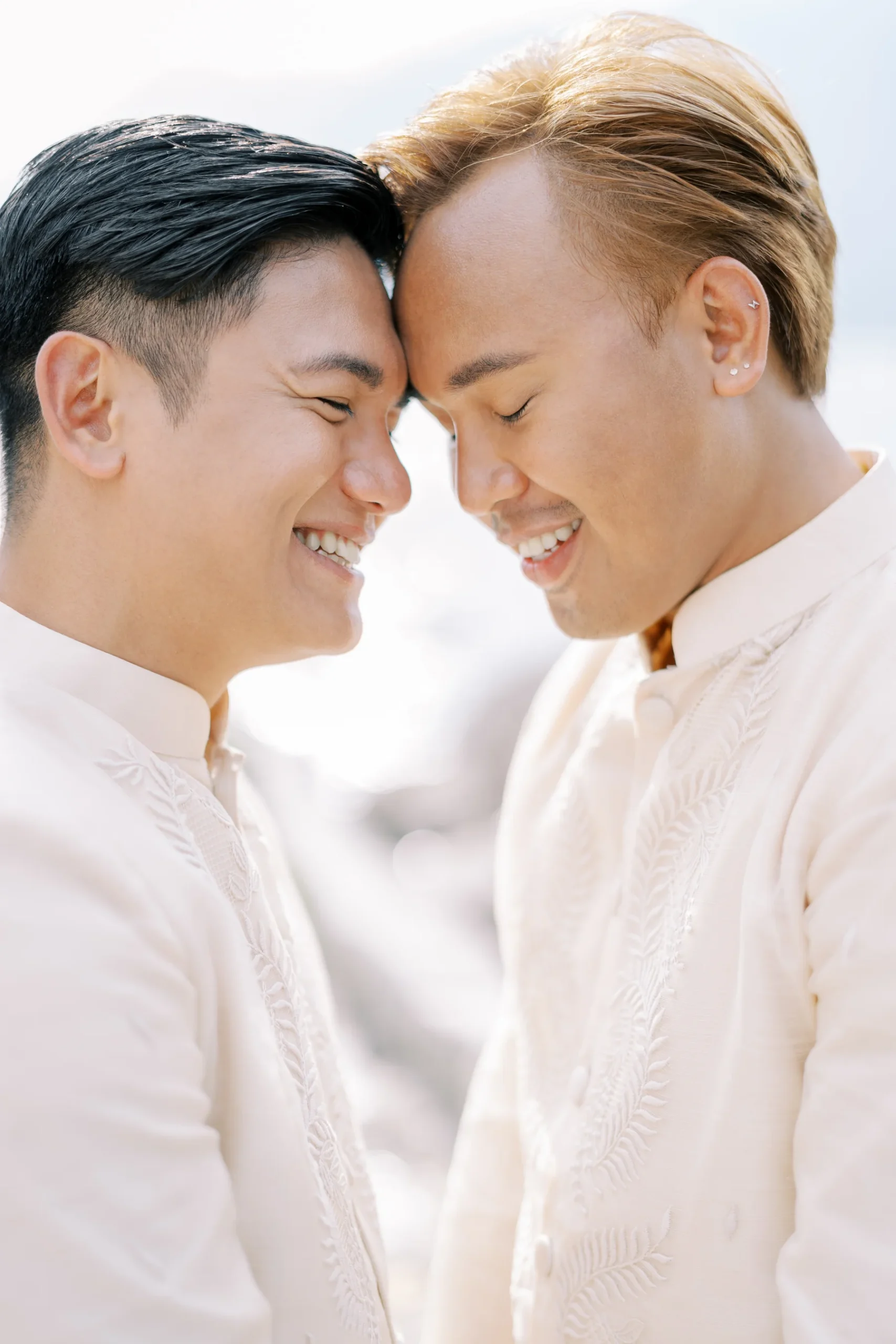 Ryan Jake and Jori smile forehead-to-forehead in white barong tagalog suits at Monte Bay Retreat in Perast, Montenegro.