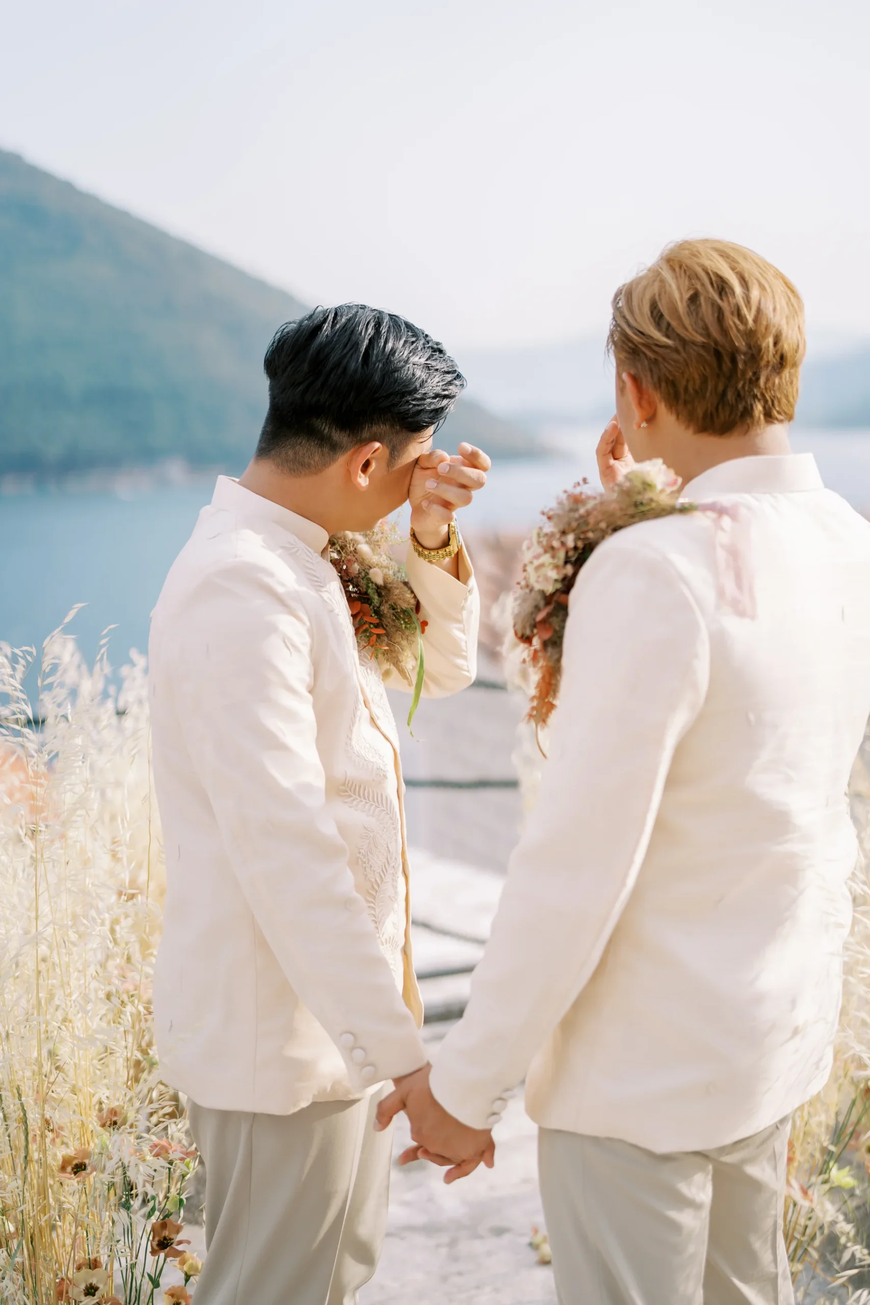 Ryan Jake Pisueña wipes away tears as Jori Blas Lazalita holds his hand during their wedding at Monte Bay Retreat in Perast, Montenegro.
