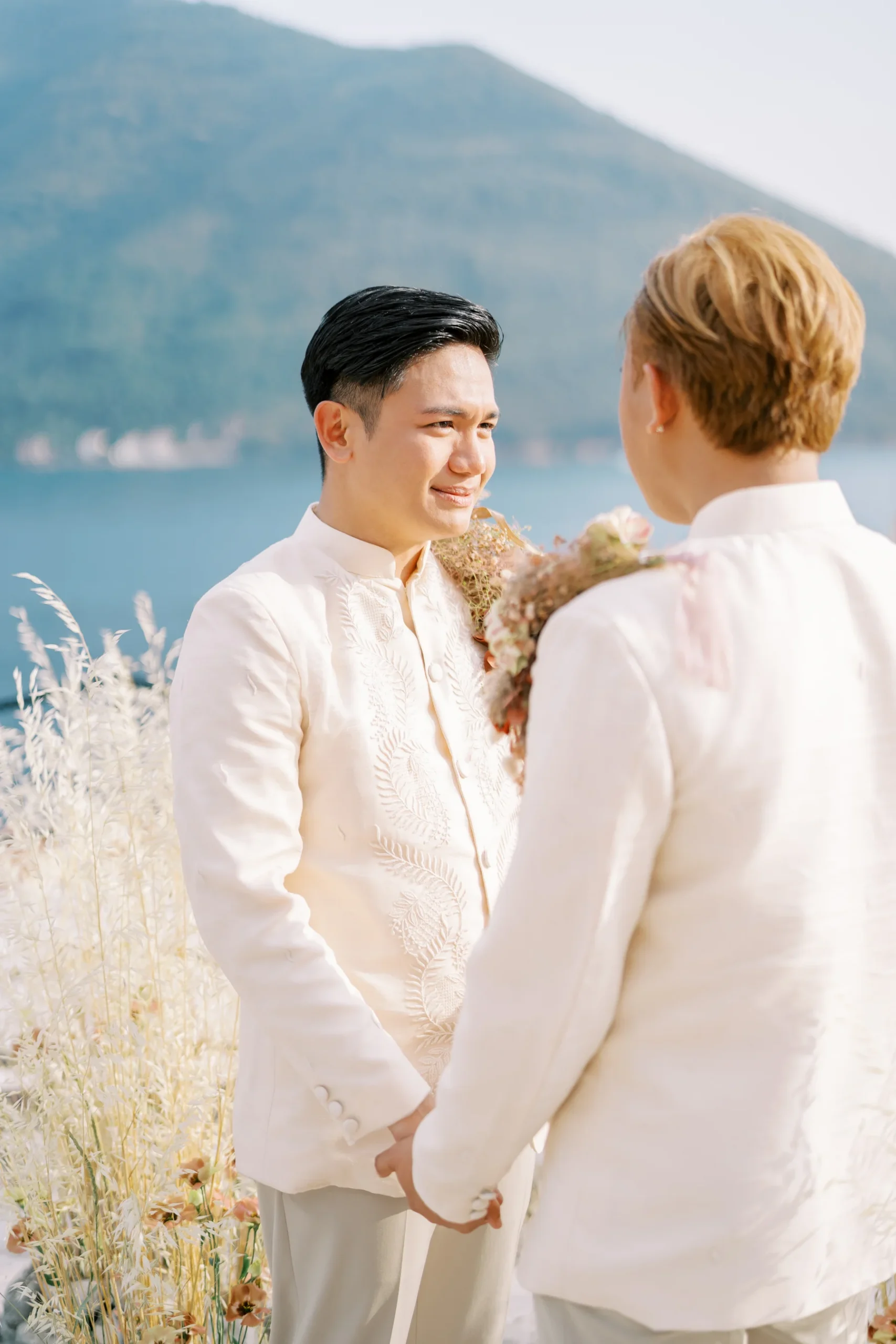 Ryan Jake Pisueña tears up holding hands with Jori Blas Lazalita during their wedding ceremony at Monte Bay Retreat in Perast, Montenegro.