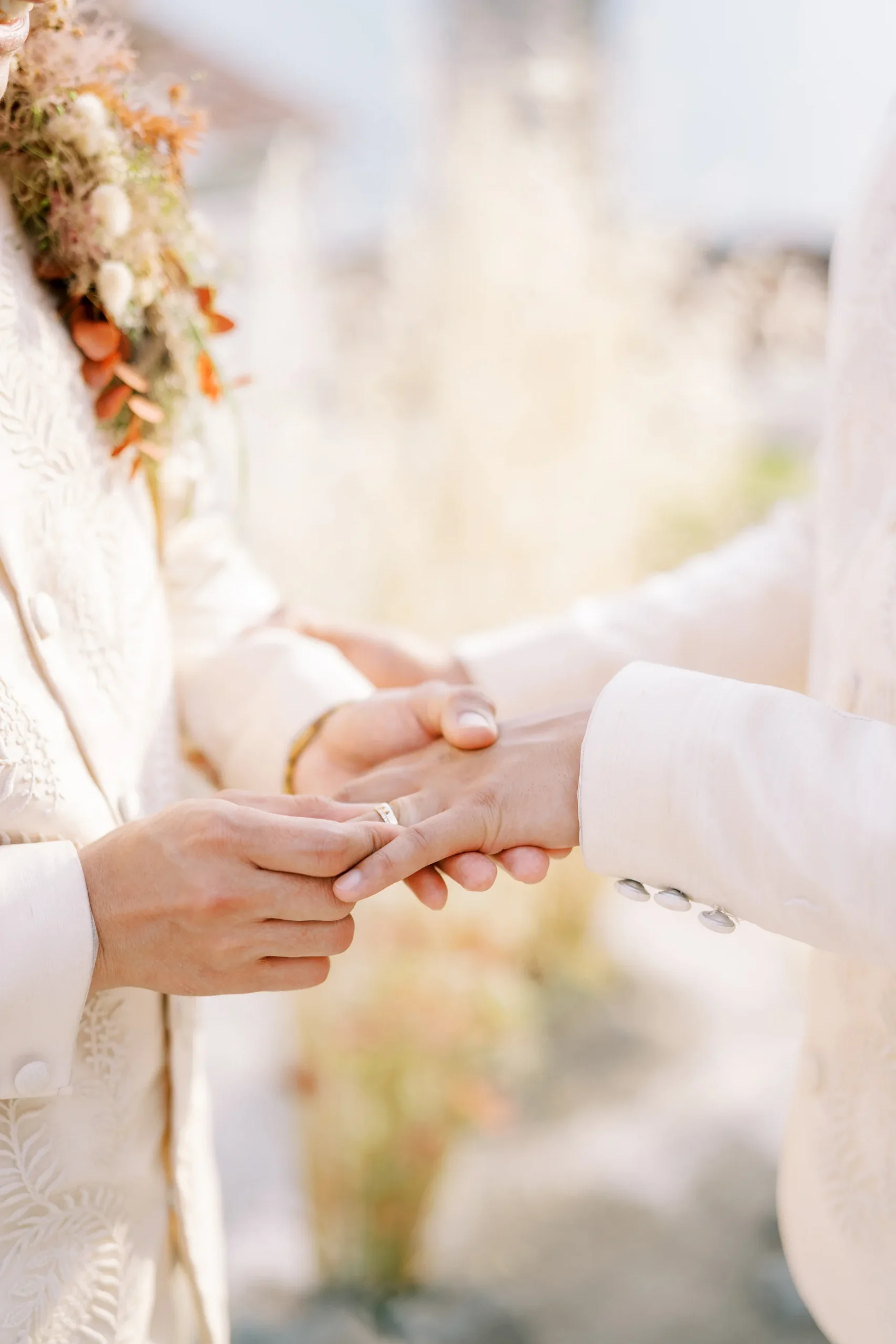 Ryan Jake Pisueña places a wedding ring on Jori Blas Lazalita's finger during their ceremony at Monte Bay Retreat in Perast, Montenegro.