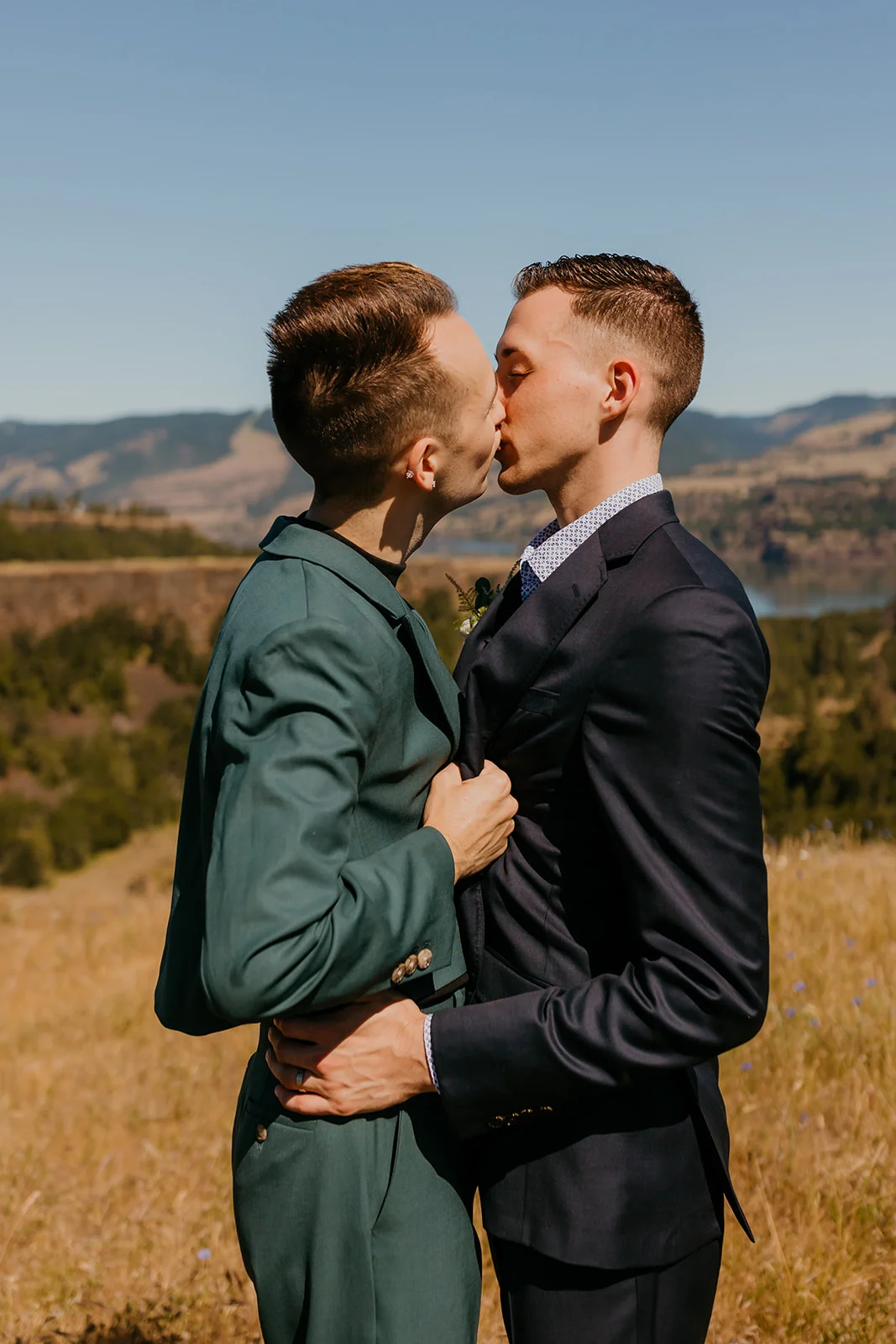 Ben and Nolan share a first kiss in formal suits at Mayer State Park in Mosier, Oregon.