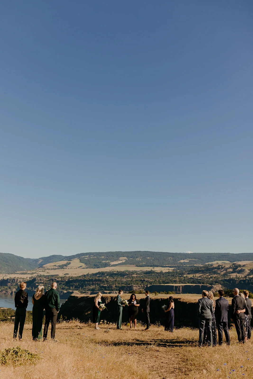 Ben and Nolan's outdoor wedding ceremony at Mayer State Park in Mosier, OR, overlooking the Columbia River Gorge.