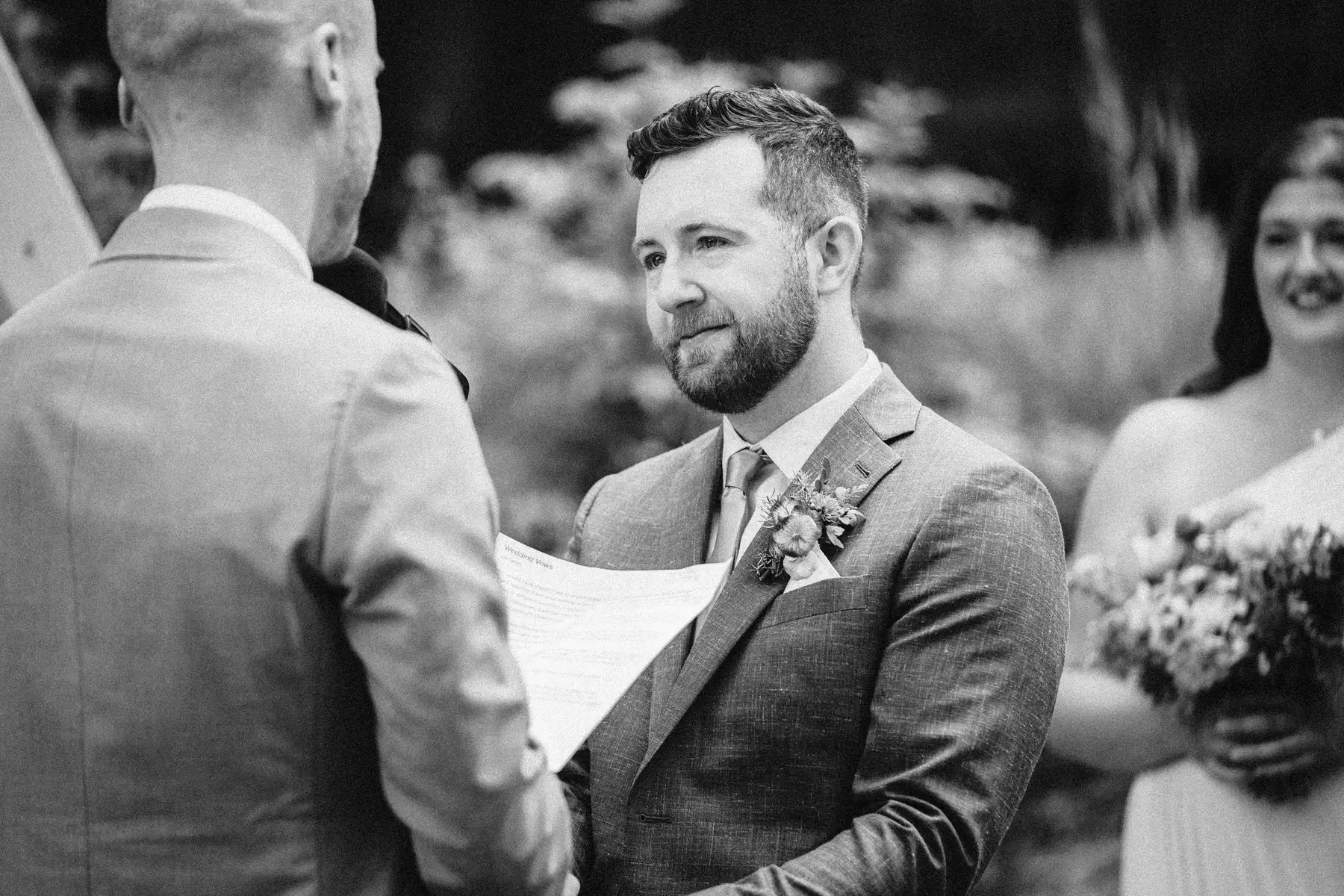 Groom Trent Harris-McCoy gazes emotionally at Cameron during vow exchange at The Hillside Lodge & Chalets in Golden, BC.