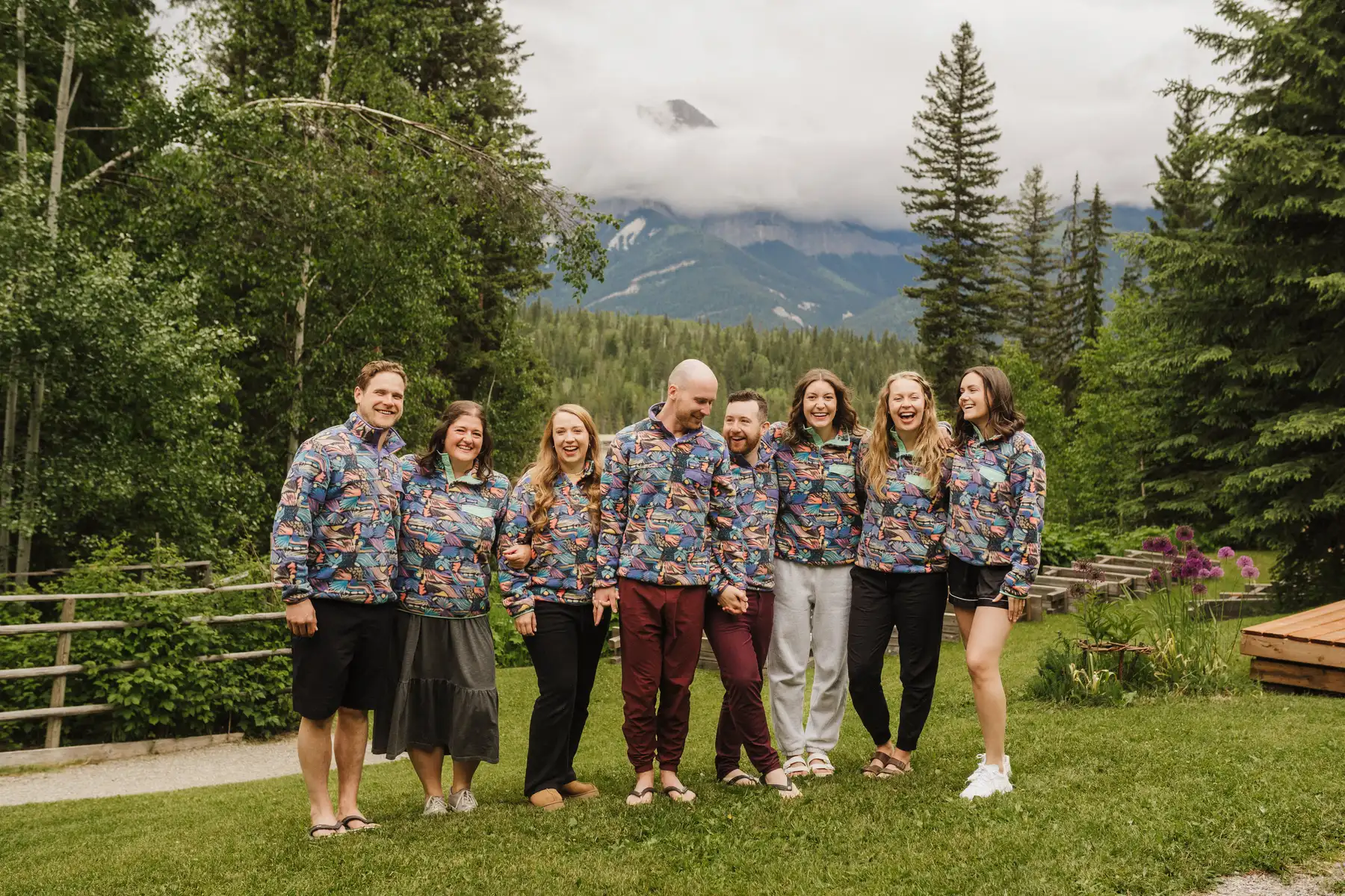 Wedding party laughs together in matching Patagonia fleeces at The Hillside Lodge & Chalets in Golden, BC, Canada.