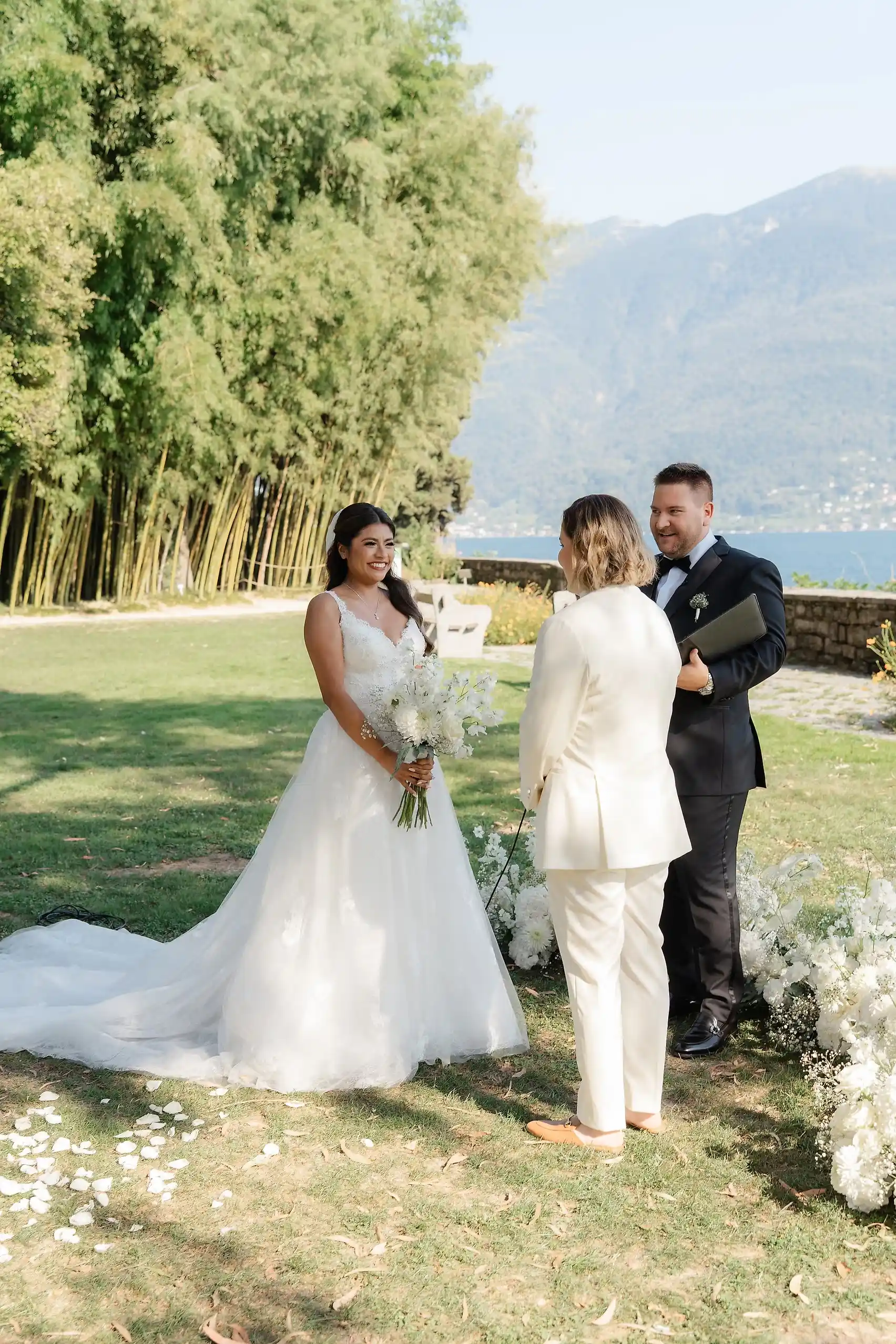 Ashley Rodriguez-Vargas and Dionne Vargas exchange vows with their officiant at Villa Emden on Brissago Island, Switzerland.