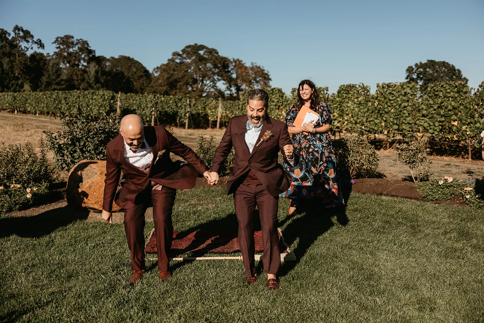 Gay grooms jump the broom