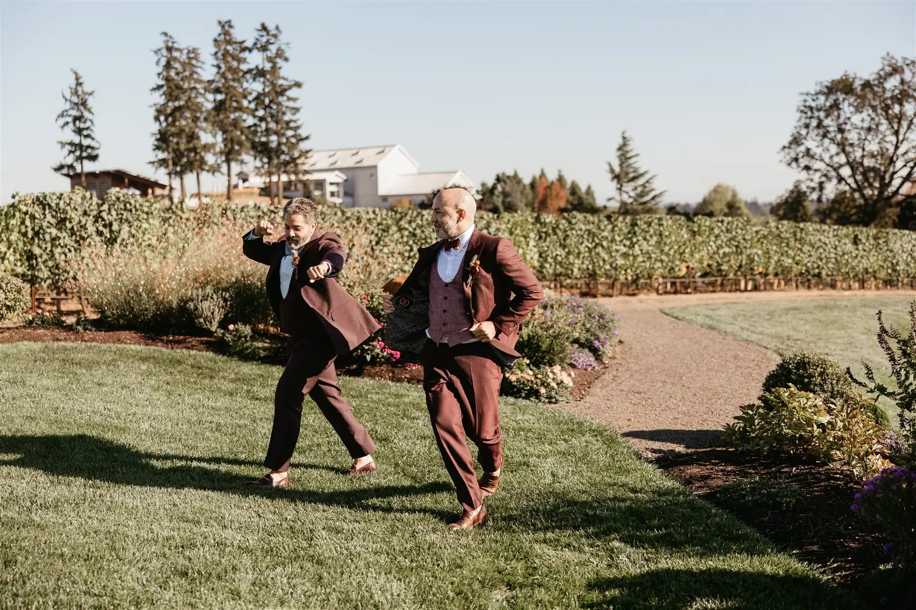 Josue Diaz and Jonathan Snowden dance playfully on the lawn at Stoller Family Estate in Dayton, OR.