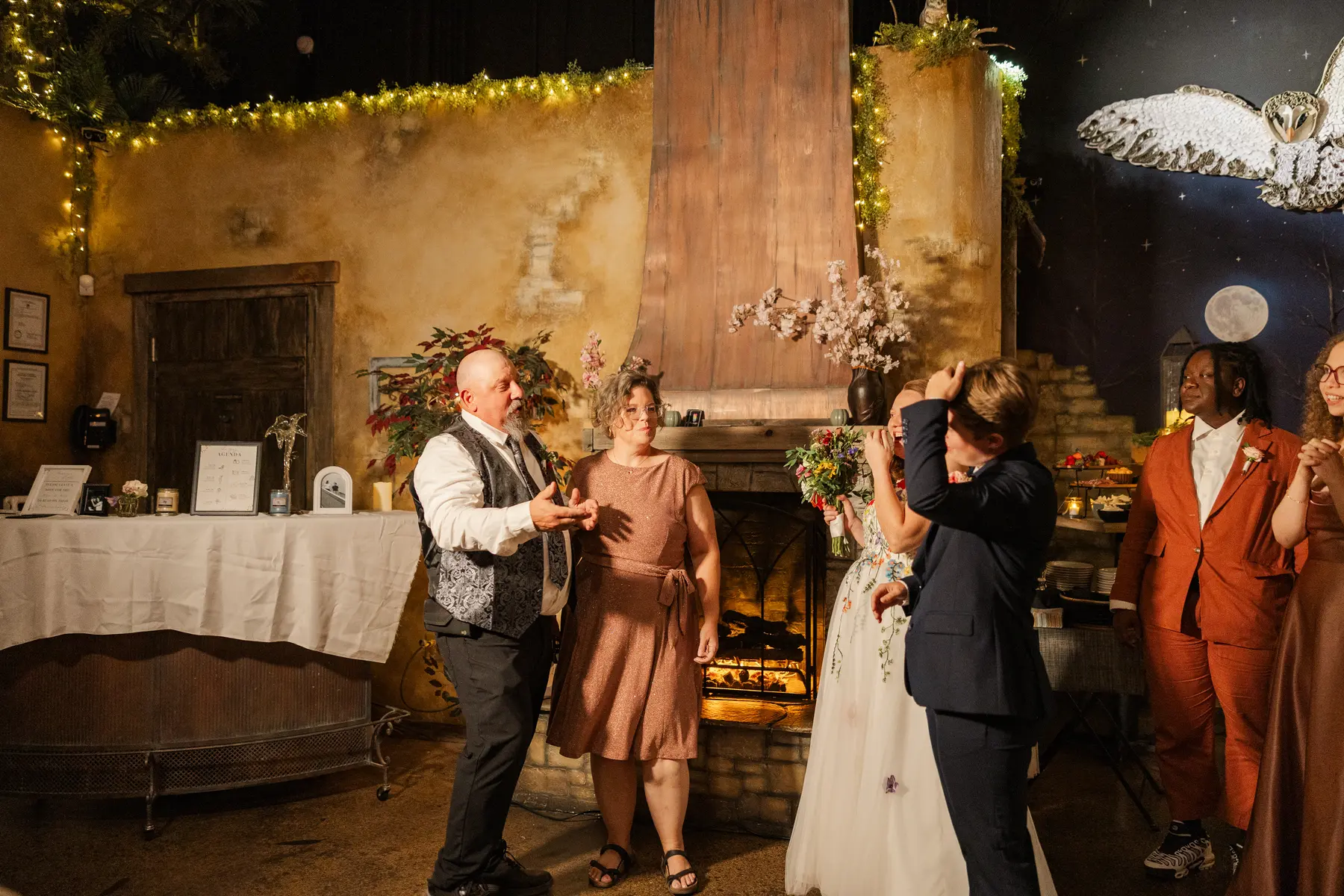 Guests dance and celebrate at Sydney and Hannah Rusow's wedding reception at Halfway House in Boulder, CO.