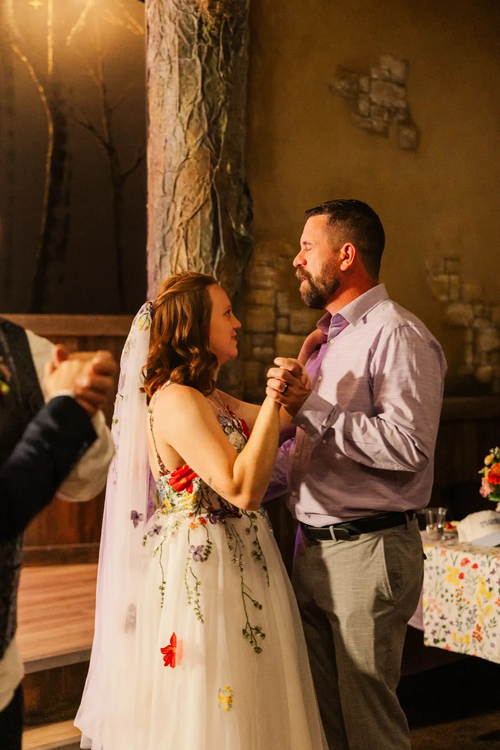 Sydney and Hannah Rusow share their first dance at Halfway House in Boulder, CO.