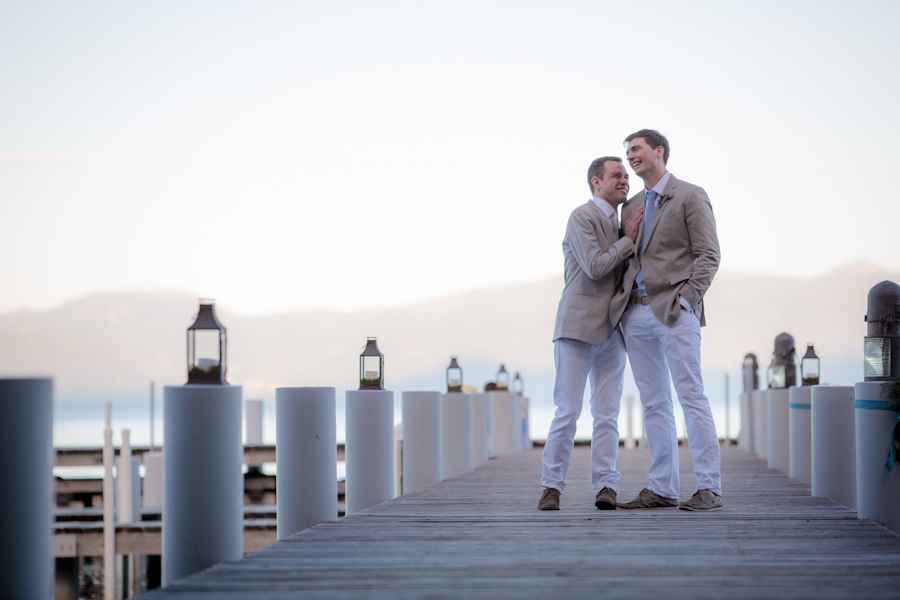jeff-sebastian-real-gay-wedding-lake-tahoe-outdoor-wedding-grooms-embrace-dock-lake-2